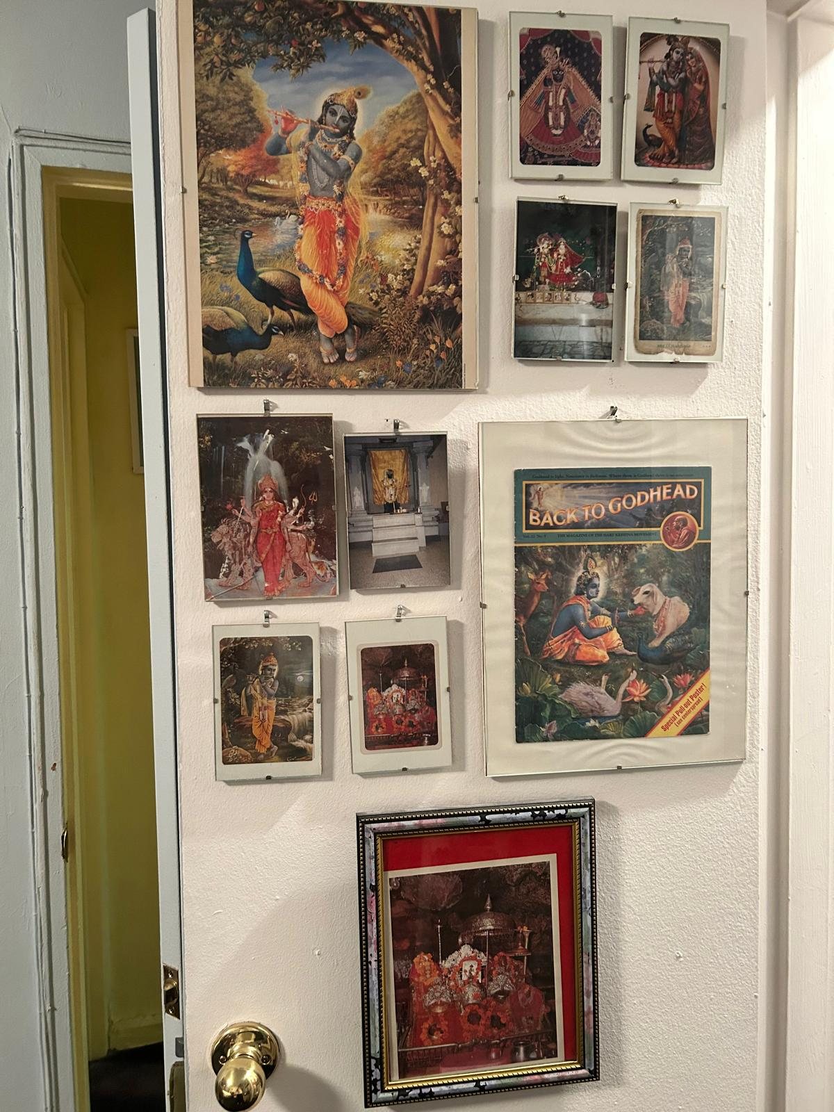 Wall of framed pictures of Hindu gods and goddesses
