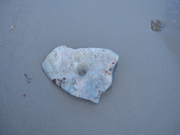 Heart shaped stone on the sand