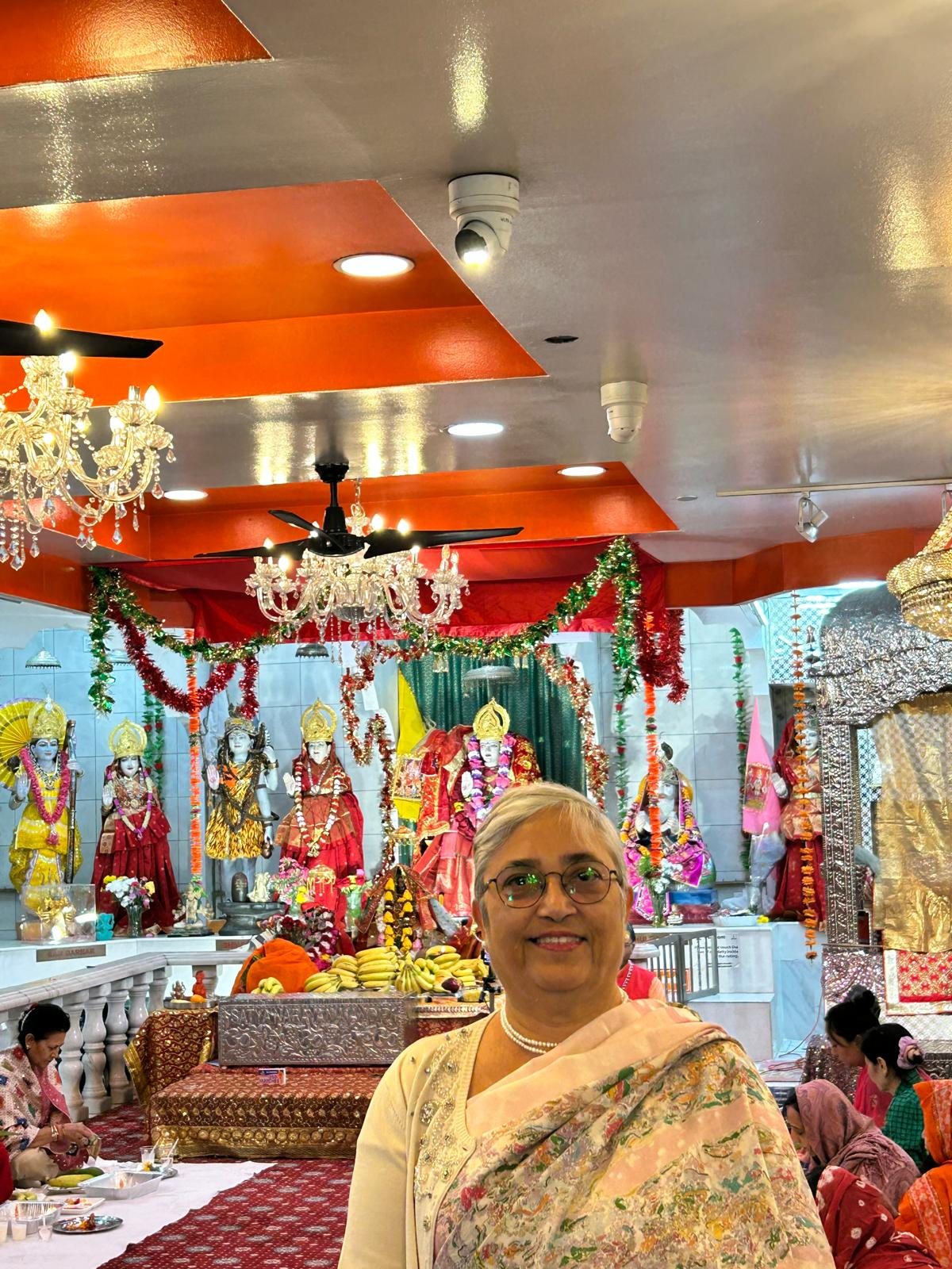 Vandana Ranjan in front of the temple altar on Ashtami
